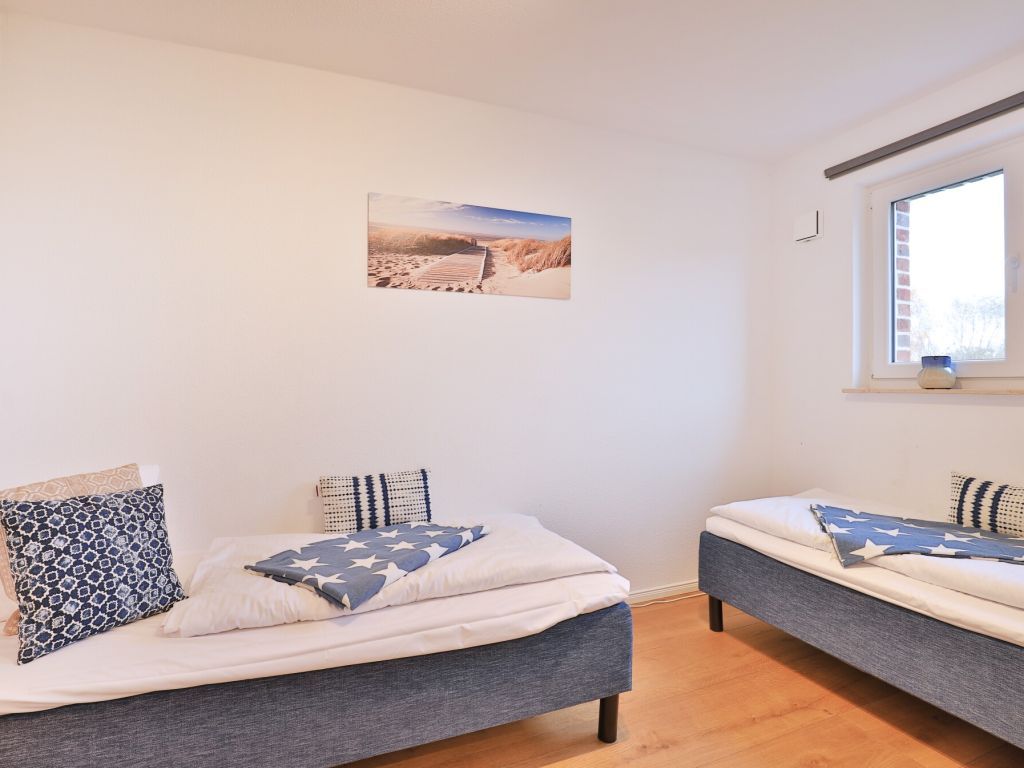 3 Meeresperlen Strandhaus - Blick in das Schlafzimmer im EG